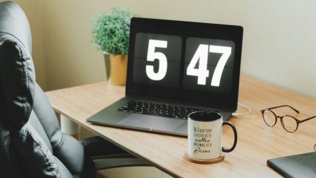 Laptop and work essentials illustrating planning and scheduling an email
