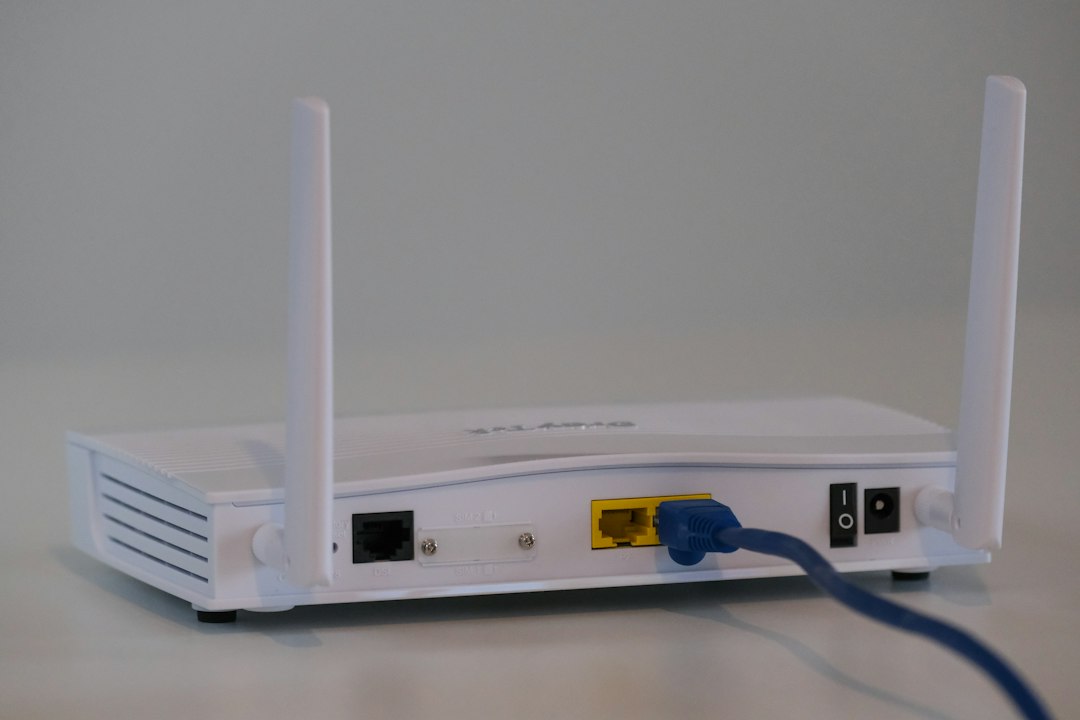 Broadband router with Ethernet cables, illustrating the cable and router checks in step two
