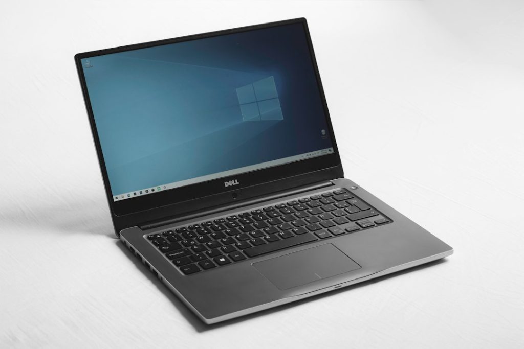 Windows laptop on a desk illustrating managing Windows 11 startup applications