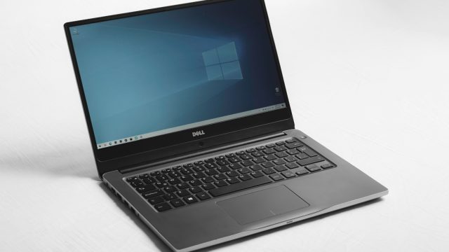 Windows laptop on a desk illustrating managing Windows 11 startup applications